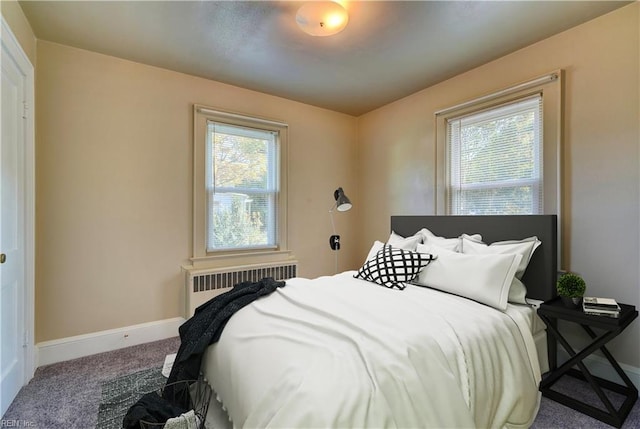 carpeted bedroom featuring radiator