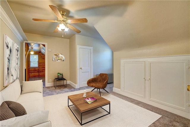 carpeted living room with ceiling fan