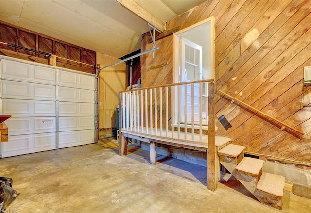 garage featuring wood walls