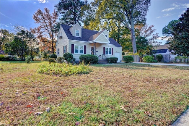 cape cod house featuring a front lawn