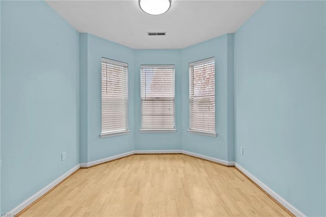 spare room featuring light hardwood / wood-style flooring