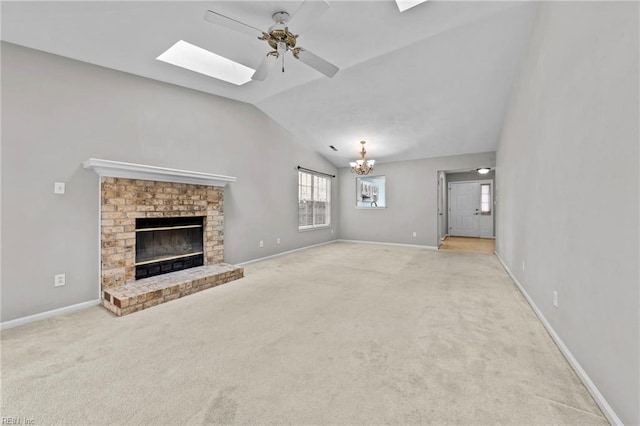 unfurnished living room featuring light colored carpet, a fireplace, and vaulted ceiling