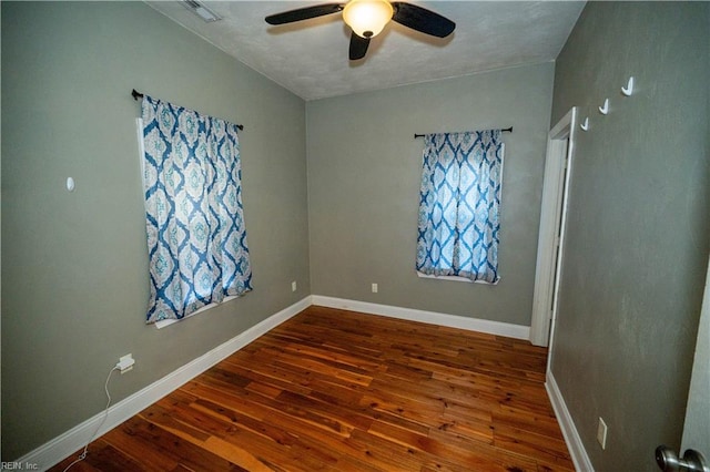 unfurnished room with ceiling fan and hardwood / wood-style floors