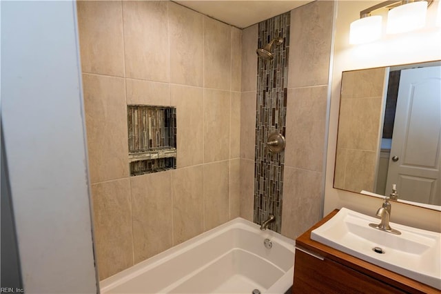 bathroom with vanity and tiled shower / bath combo