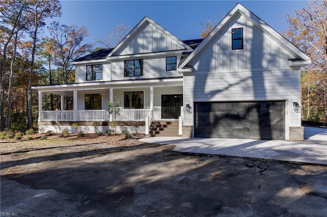 view of front of property featuring a porch and a garage