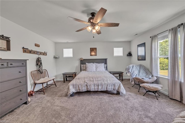 bedroom featuring ceiling fan and light carpet