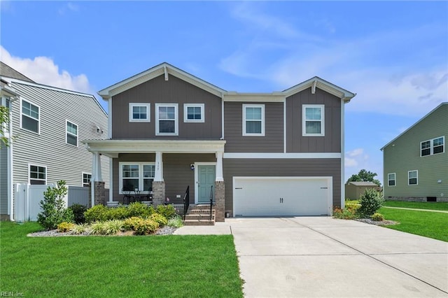 view of front of property with a front yard and a garage