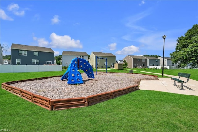 view of jungle gym with a lawn