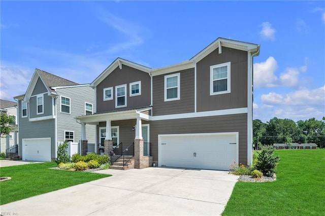 view of front of home with a front yard and a garage