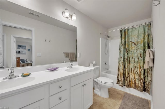 full bathroom with tile patterned flooring, vanity, shower / bath combo, and toilet