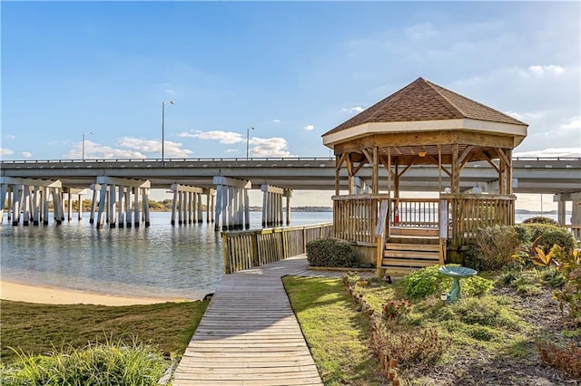 dock area with a gazebo and a water view