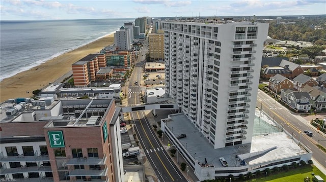 aerial view with a water view and a view of the beach