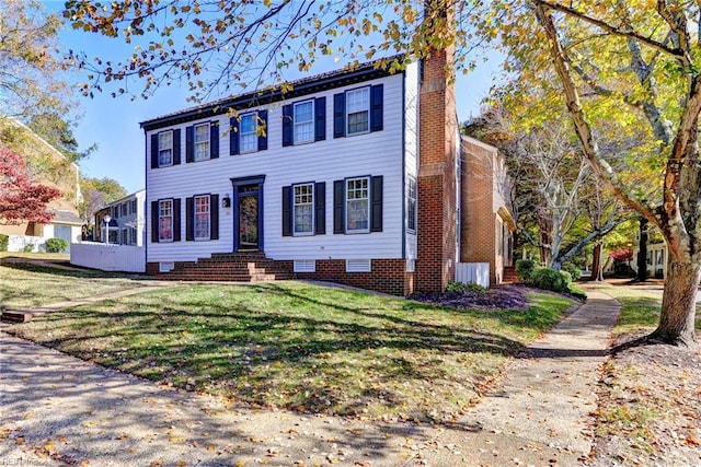 view of front of home with a front yard