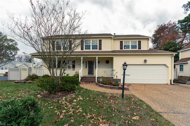 front of property with a front lawn, a porch, and a garage