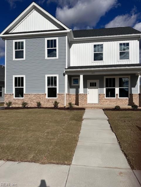 view of front of property with a front lawn