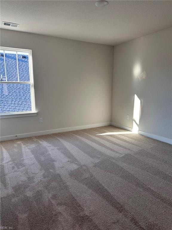 spare room with carpet flooring