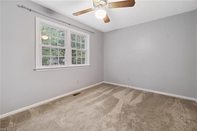 carpeted empty room with ceiling fan