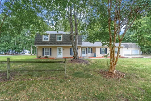 view of front of home featuring a garage, a porch, and a front yard