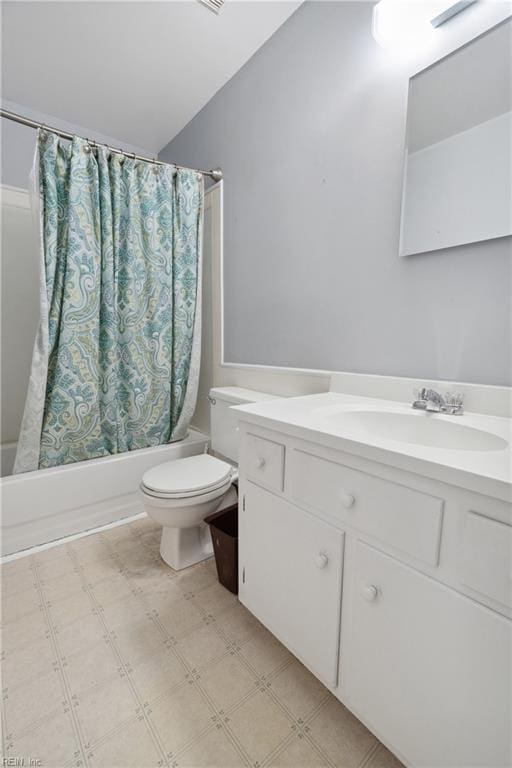 full bathroom with vaulted ceiling, vanity, shower / tub combo, and toilet