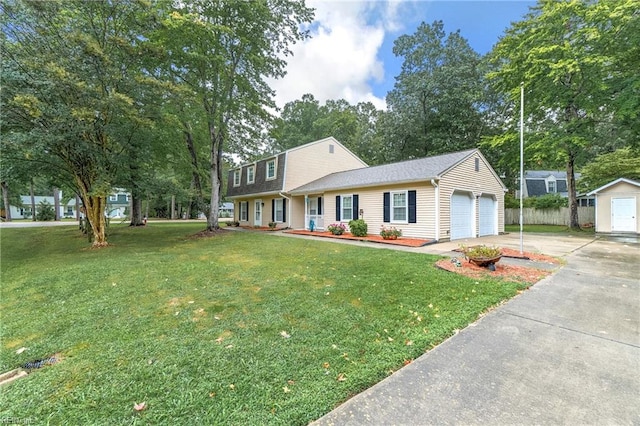 view of front of house featuring a garage and a front yard