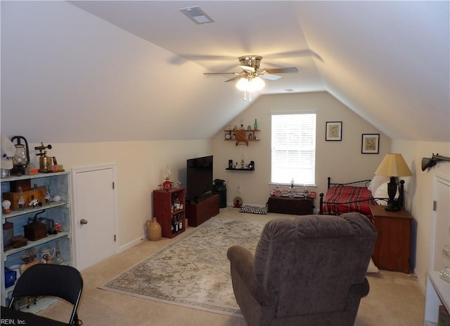 living room with ceiling fan, light carpet, and vaulted ceiling