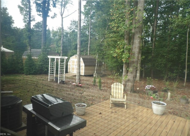 deck with a storage shed and central air condition unit