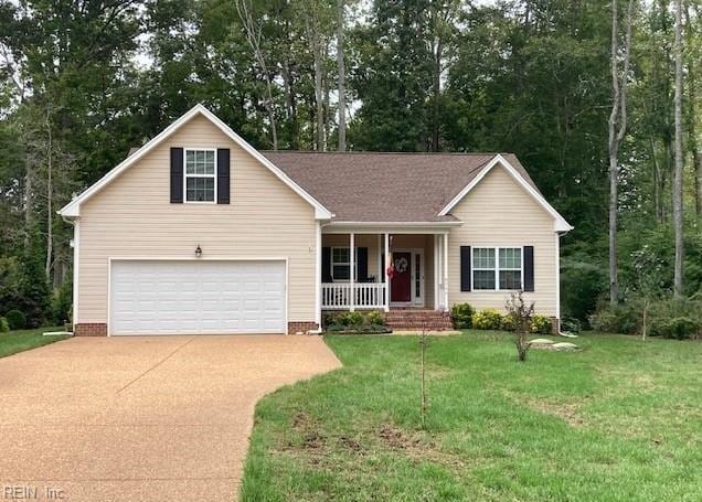 single story home with a porch, a garage, and a front lawn