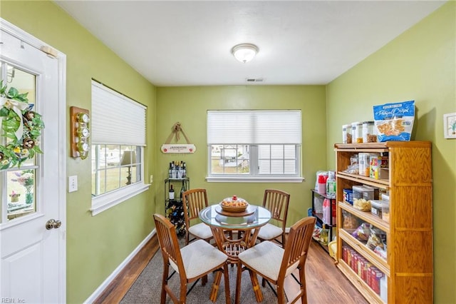 dining space featuring hardwood / wood-style floors