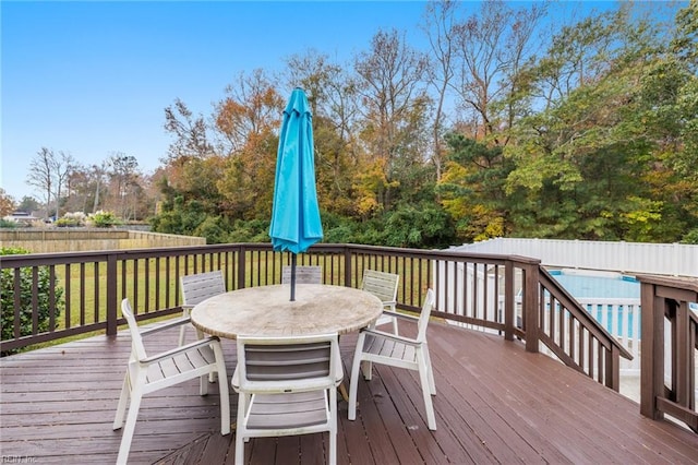 wooden terrace featuring a pool