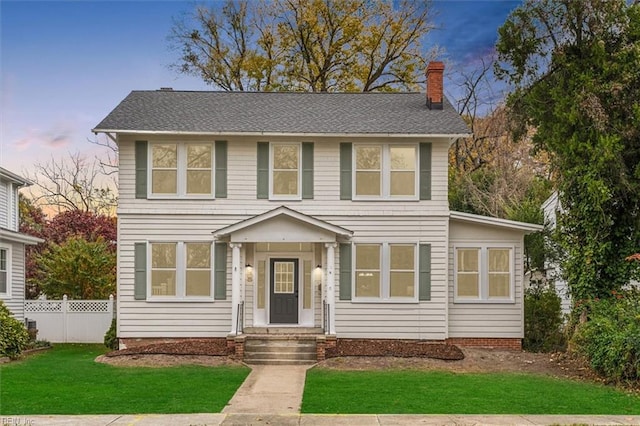 view of front of property with a lawn