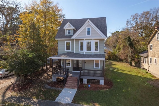 view of front of house featuring covered porch and a front yard