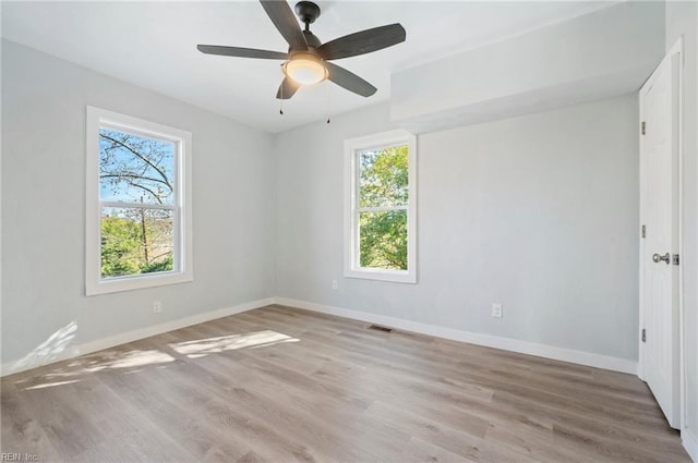 empty room featuring ceiling fan and light wood-type flooring