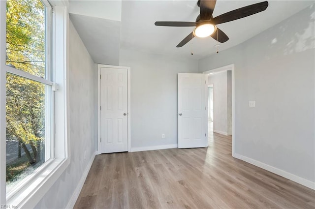 unfurnished bedroom with light hardwood / wood-style flooring and ceiling fan