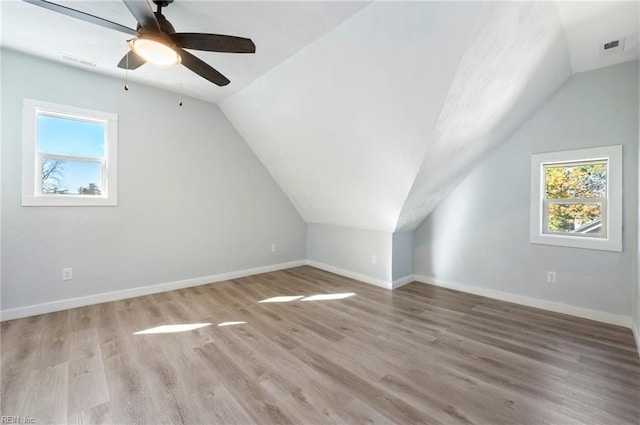 additional living space featuring ceiling fan, light wood-type flooring, and lofted ceiling