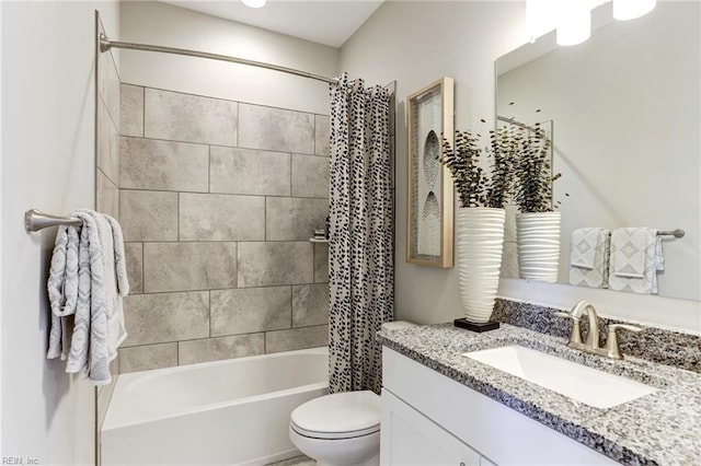 full bathroom featuring shower / bath combination with curtain, vanity, and toilet