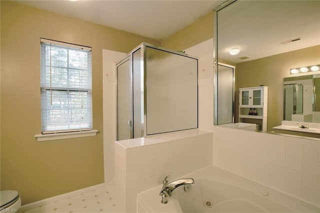 full bathroom with vanity, toilet, and independent shower and bath