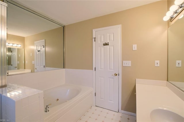 bathroom featuring vanity and a bathing tub