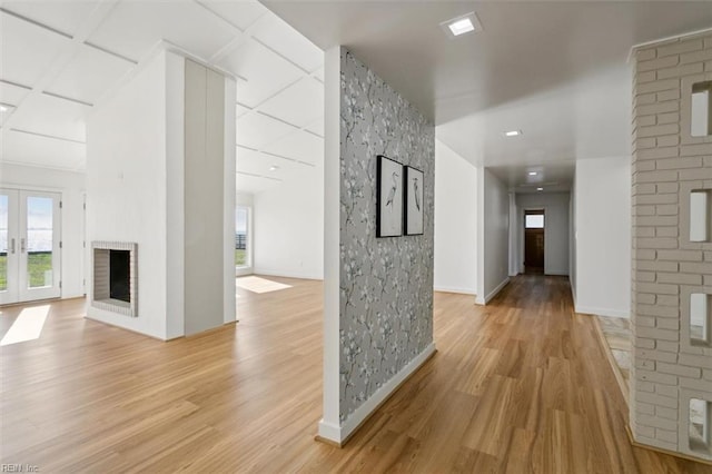 hall featuring french doors and light hardwood / wood-style floors