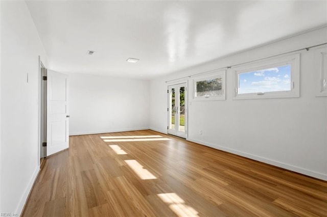 unfurnished room featuring light wood-type flooring