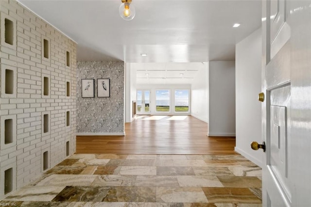 hall with light hardwood / wood-style flooring