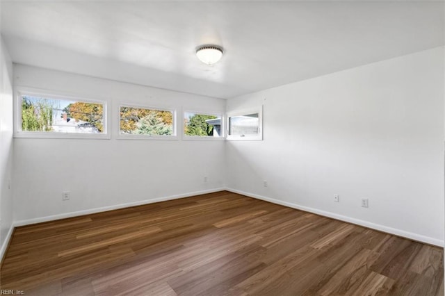 empty room featuring dark hardwood / wood-style floors