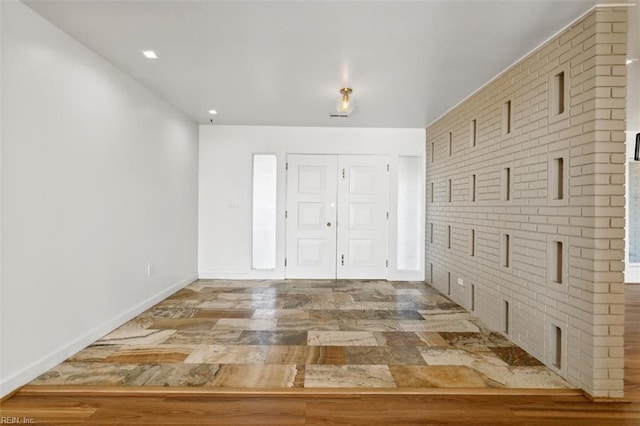 foyer entrance featuring hardwood / wood-style flooring