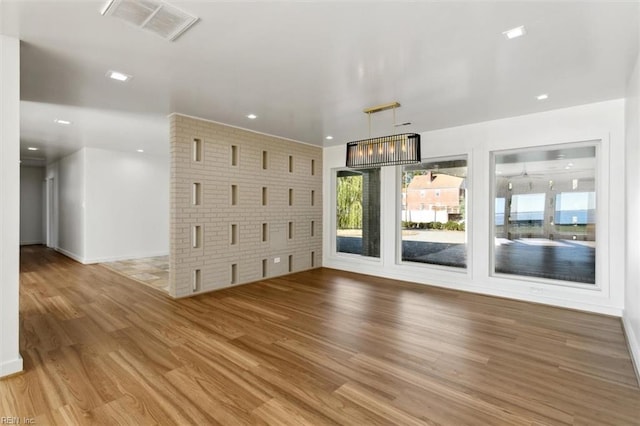 unfurnished living room with hardwood / wood-style floors