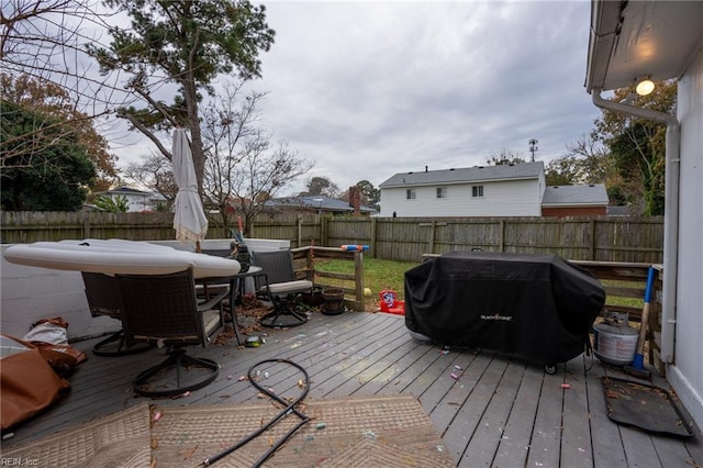 wooden terrace with area for grilling