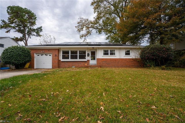 single story home with solar panels, a garage, and a front lawn