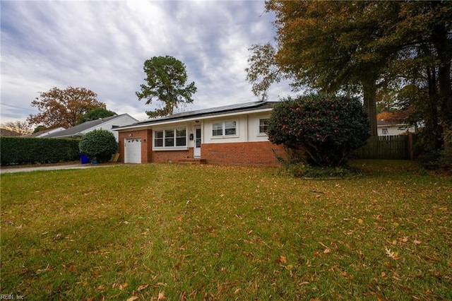 ranch-style house with a front yard and a garage