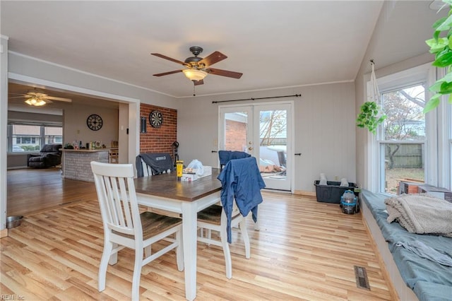 dining room featuring a healthy amount of sunlight and light wood-type flooring