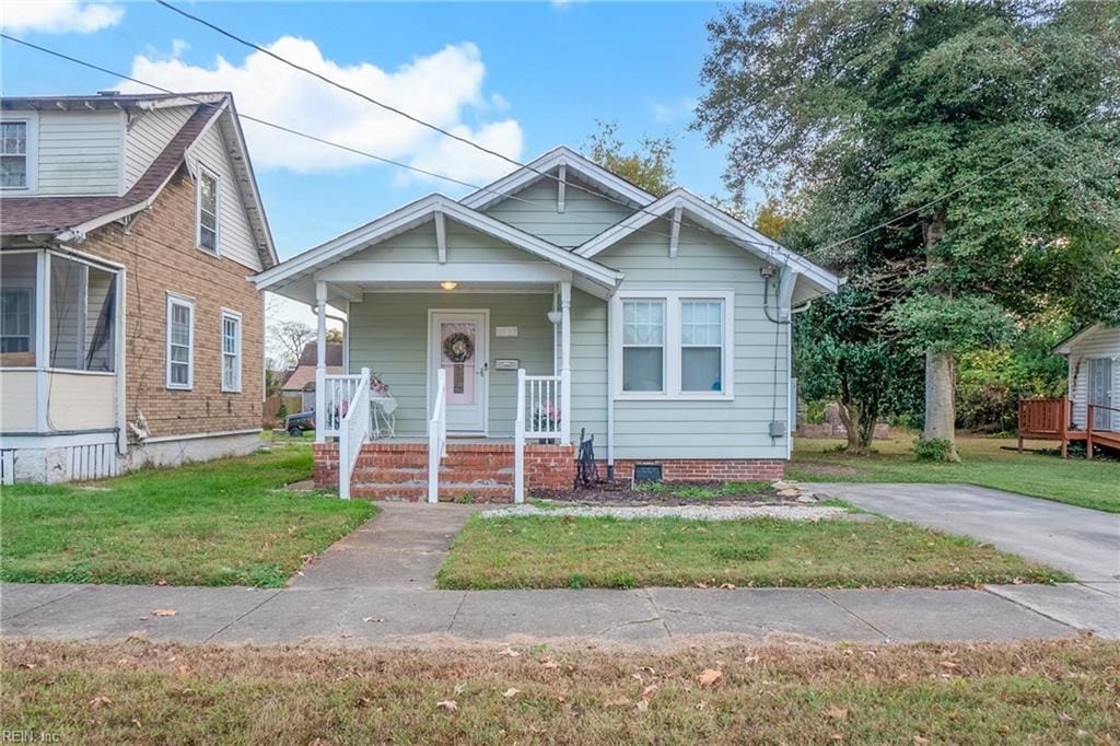 bungalow with a front lawn