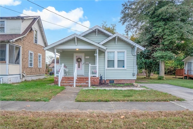 bungalow with a front lawn