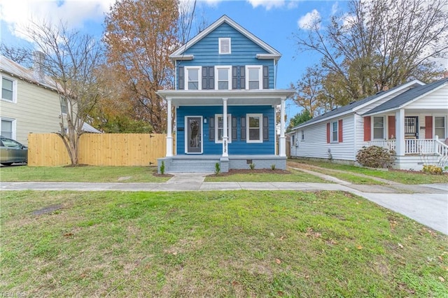 view of front of property featuring covered porch and a front yard